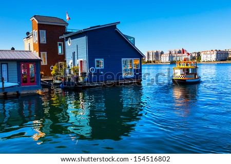 Floating Home Village Blue Houseboats Water Taxi Fisherman\'S Wharf Reflection Inner Harbor, Victoria British Columbia Canada Pacific Northwest. Area Has Floating Homes, Piers, Restaurants.