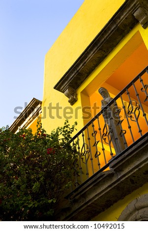 Stone Jesus, Yellow Adobe Wall, Red Flower, Garden Guadalajara Mexico