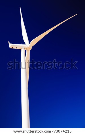 Wind Turbine Abstract.  White Wind Turbine and Blades Against Blue Sky Palouse Hills Washington