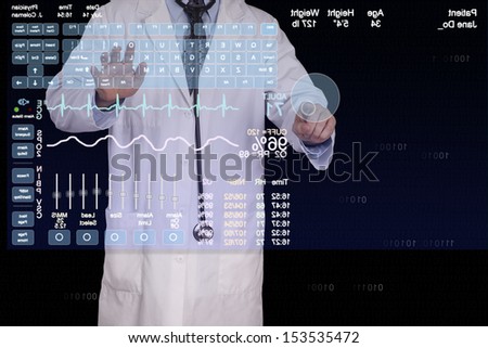 A medical professional using a virtual computer to enter a patients information.