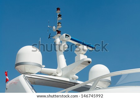 Close details of radar  navigation system and communication tower on a fancy motor yacht