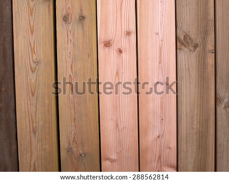 Selection of wood siding panels for sale in a store