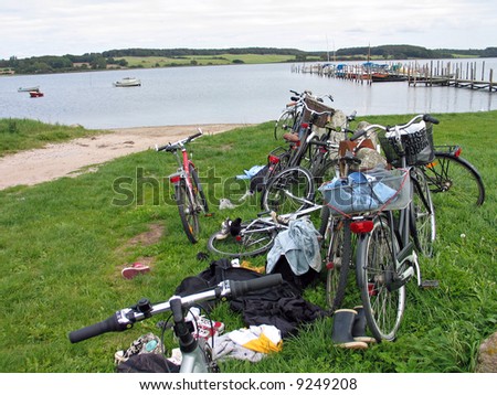 Stack of young people's bicycles by the beach