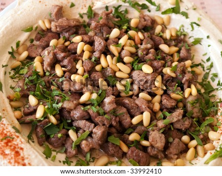 Fresh Hummus with lamb meat and parsley Middle East Arabic food