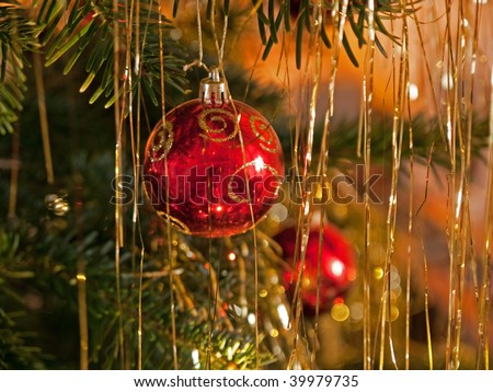Christmas decoration beautiful red golden balls on a festive tree