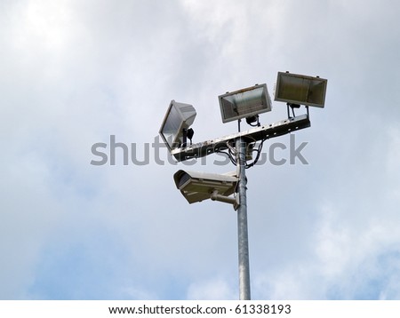 Security surveillance camera on a metal pole Big Brother is watching