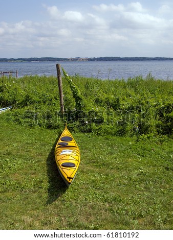 Kayak on the beach ready for action - sea sport background image