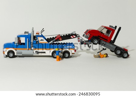Aalter, Belgium, 10 september 2014, tow truck in action, displayed in lego on a white background