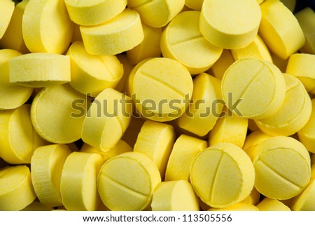 yellow pills close up shot