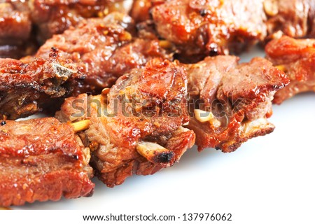 grilled pork with short ribs on plate close up