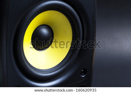 audio speaker on black background close up