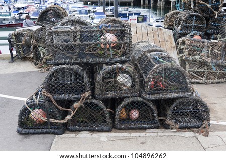Lobster pots on the harbourside at Torquay, England, UK.