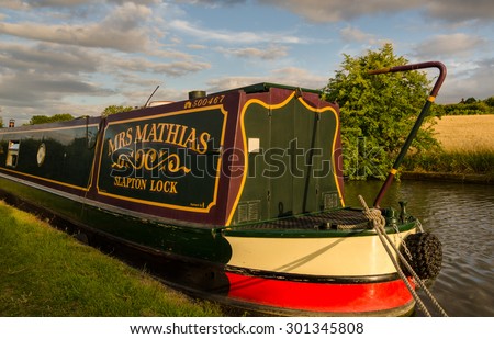 Living on a Canal boat - Radford Semele, UK - July 21, 2015: Narrow-boat moored on the English Grand Union Canal, near Radford Semele, Warwickshire. The houseboat is named 