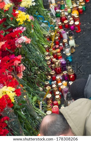 KIEV, UKRAINE - 23 February 2014: Citizens of Ukraine came in a day of mourning for the dead in the confrontation with the security forces, lay flowers and light candles