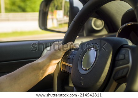 man hands holding black wheel
