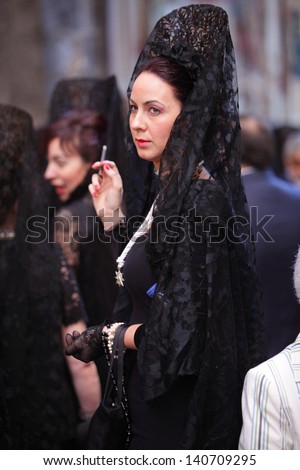TOLEDO/SPAIN-MAY 30 : an unidentified woman dressed in traditional suite for Corpus Christi holiday on may 30th 2013 in Toledo, Spain.