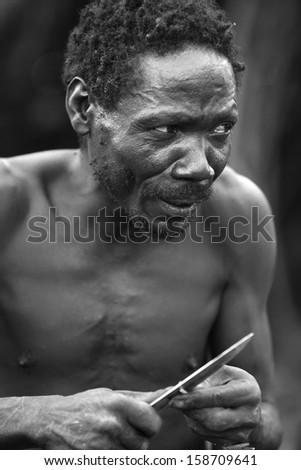 LAKE EYASI,ARUSHA/TANZANIA-CIRCA FEBRUARY 2012: portrait of unidentified member of the Hadza tribe circa Feb 2012 in Lake Eyasi. The Hadza are the last hunter-gatherers, clic-speakers of Tanzania.