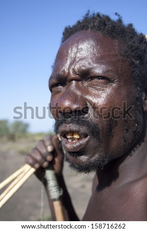 LAKE EYASI, ARUSHA/TANZANIA-CIRCA FEBRUARY 2012: portrait of unidentified member of the Hadza tribe circa Feb 2012 in Lake Eyasi. Hadza is the last tribe of hunter-gatherer, clic-speakers of Tanzania.