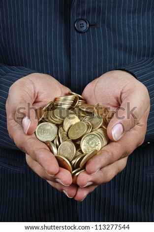 Indian Gold Coins in Hands