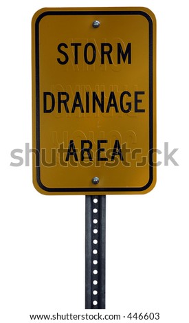 A recycled sign now used for a storm drainage area sign isolated on a white background.