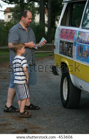 Classic Childhood.. A father and son buy dessert from an ice cream truck.