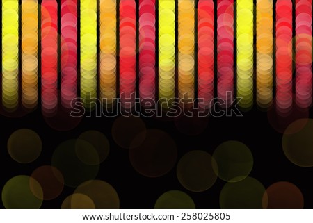Abstract pattern background with red, orange and yellow circles on black