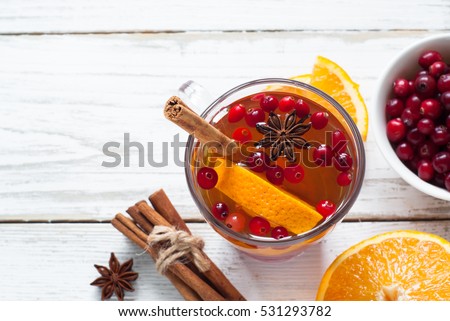 Cup of Hot tea with fruit and spices. Black fruit tea.