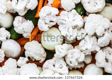 Background made with chopped pieces of Cauliflower on mixed fresh vegetables /Chopped Cauliflower on vegetables