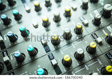 Sound studio adjusting record equipment, music mixer