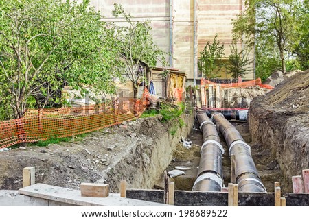 Work is in progress, burying pipeline in urban area