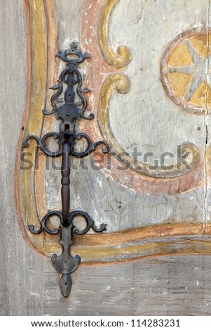 metallic  handle on old wooden door