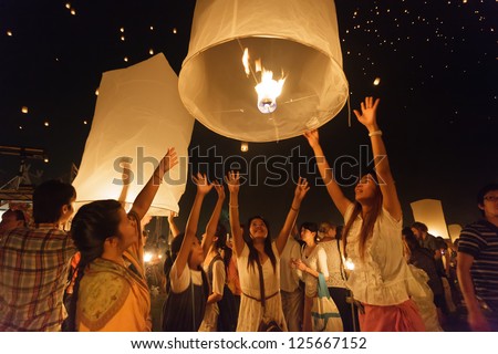 CHIANGMAI THAILAND NOVEMBER 24 : thai people launching sky lantern in Loy Krathong and Yi Peng Festival on november 24, 2012 Chiangmai, Thailand
