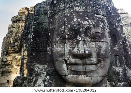 Religious giant faces sculpture in Bayon temple, Angkor, Cambodia