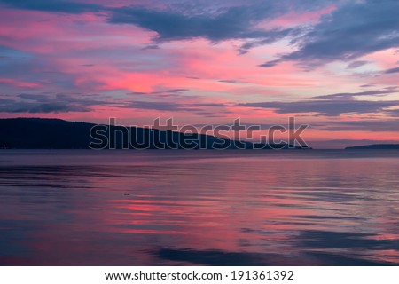 Scenic background of a pink and blue sunset on a cloudy overcast evening