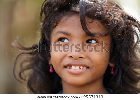 SIEM REAP, CAMBODIA, DECEMBER 04 : Cambodian little girl portrait in a village near Siem Reap, Cambodia on December 04, 2012