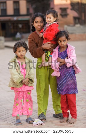 BHAKTAPUR, NEPAL, NOVEMBER 24, 2010: A group of Nepalese little girls posing in the main Bhaktapur square