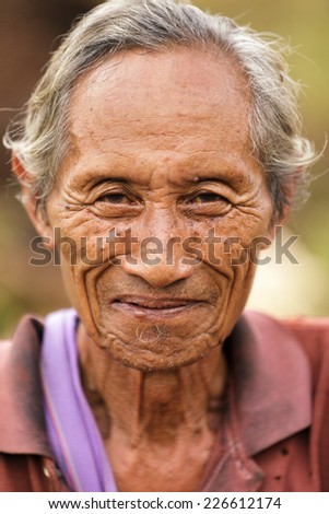 UMPHANG, THAILAND, NOVEMBER 30 : close portrait of an elderly Karen tribe man, Thai ethnicity, near the village of Umphang, north Thailand on November 30, 2012