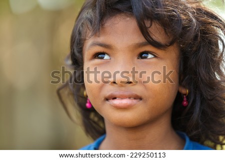 SIEM REAP, CAMBODIA, DECEMBER 04, 2012 : Cambodian little girl in a village near Siem Reap, Cambodia.