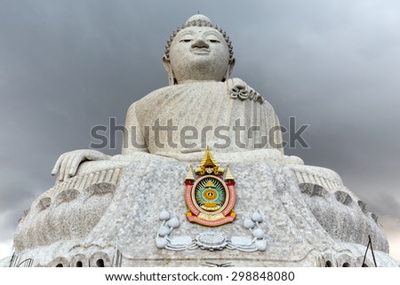 The Phuket Big Buddha at the top of the hill under a stormy sky