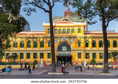 HO CHI MINH, VIETNAM, FEBRUARY 25, 2015 : Large view on the central French colonial style post office with tourists in Ho Chi Minh city (Saigon), Vietnam
