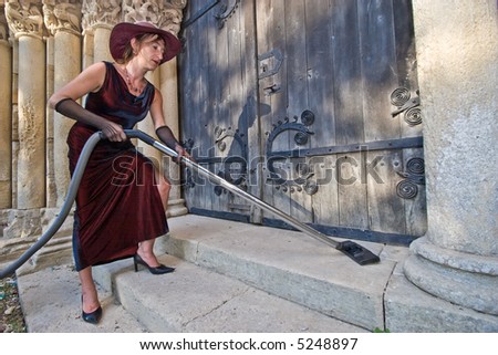 woman cleaning church stairs with hoover