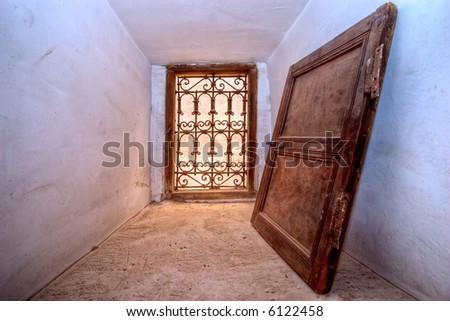 arabian shutter against a wall in a deep window