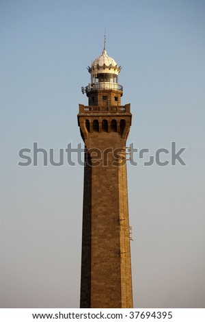 high eckmuhl stone lighthouse at sunset, brittany, france