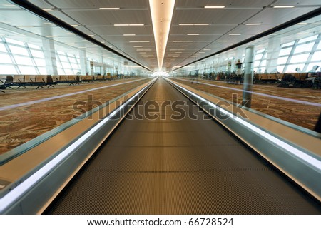 dynamic view of moving walkway in international airport, Delhi, India
