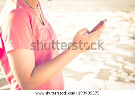 Lifestyle Smartphone Tech User Enjoying Vacation with retro filtered color effect