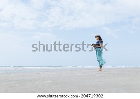 Tablet User Lifestyle On The Beach