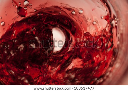 Red drops all over a swirling red whirlpool