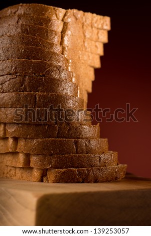Tower of brad slices isolated on red in studio