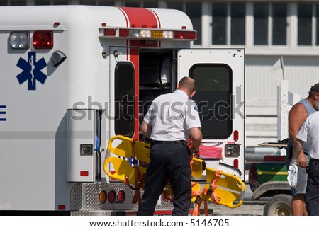 paramedic at accident unloading back board