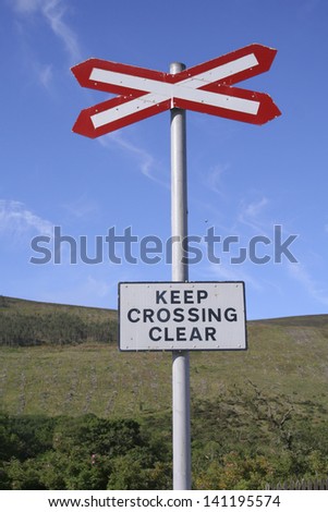Road Sign of Keep Crossing Clear